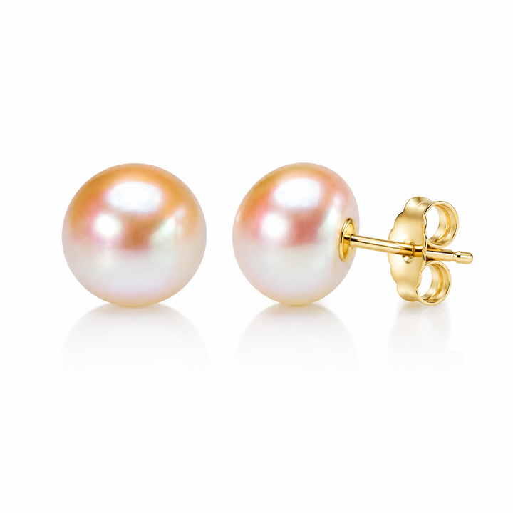 Pair of peach sunrise button pearl studs on 14K gold finish posts with butterfly backs