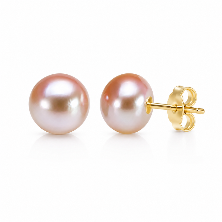 Pair of blush pink button pearl studs on 14K gold finish posts with butterfly backs