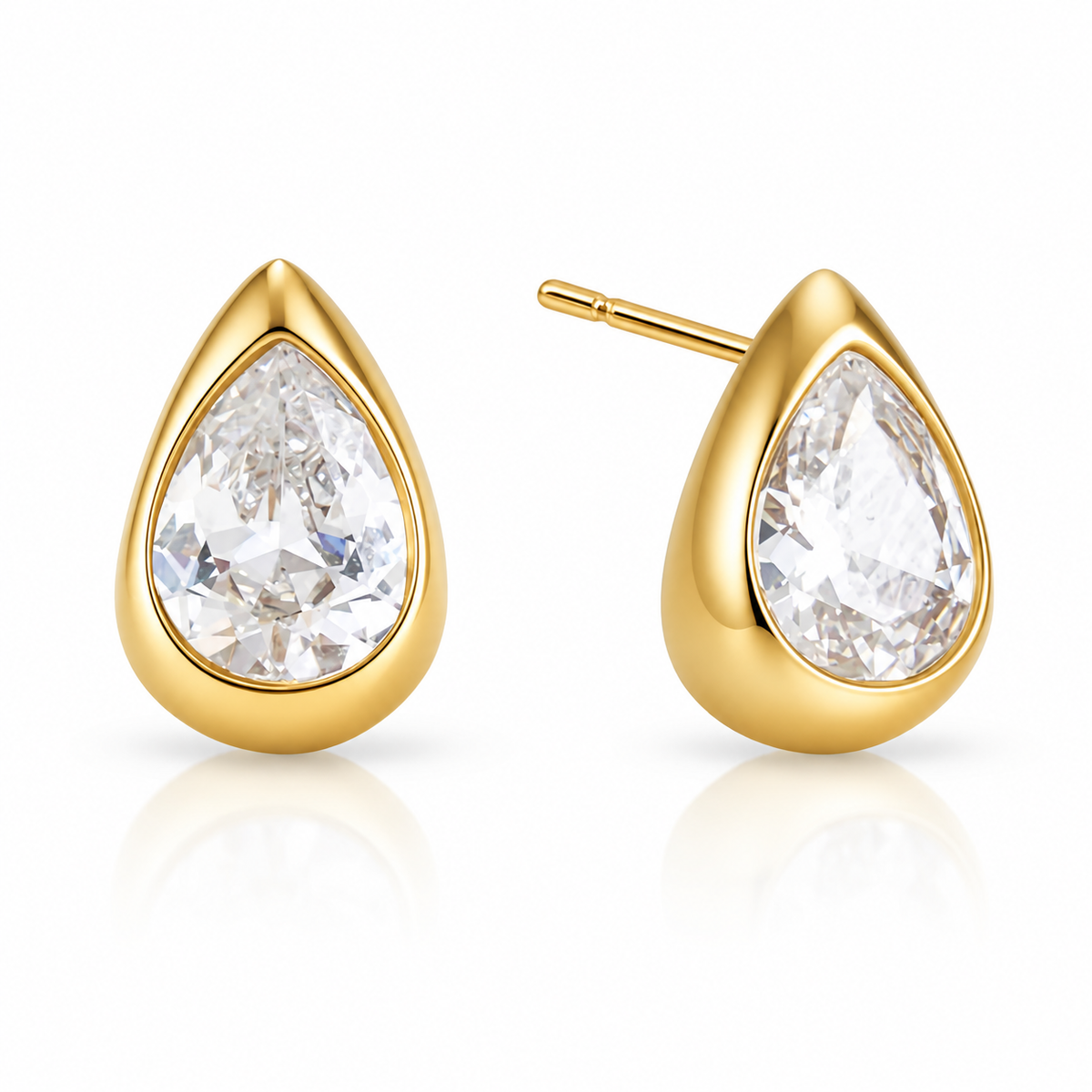 Pair of gold stud earrings, each a pear-cut clear stone in a bezel