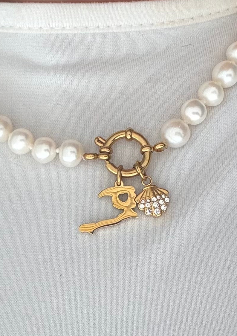 Radiant shell charm