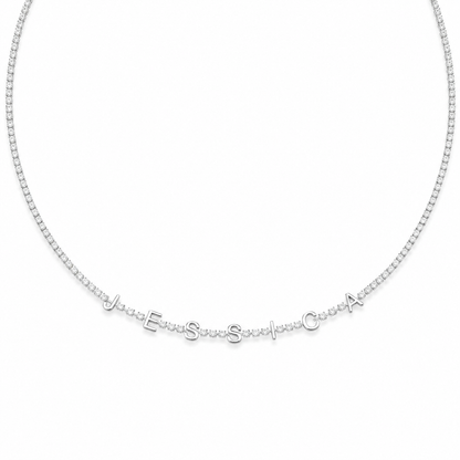 White gold finish tennis chain spelling JESSICA in block letters