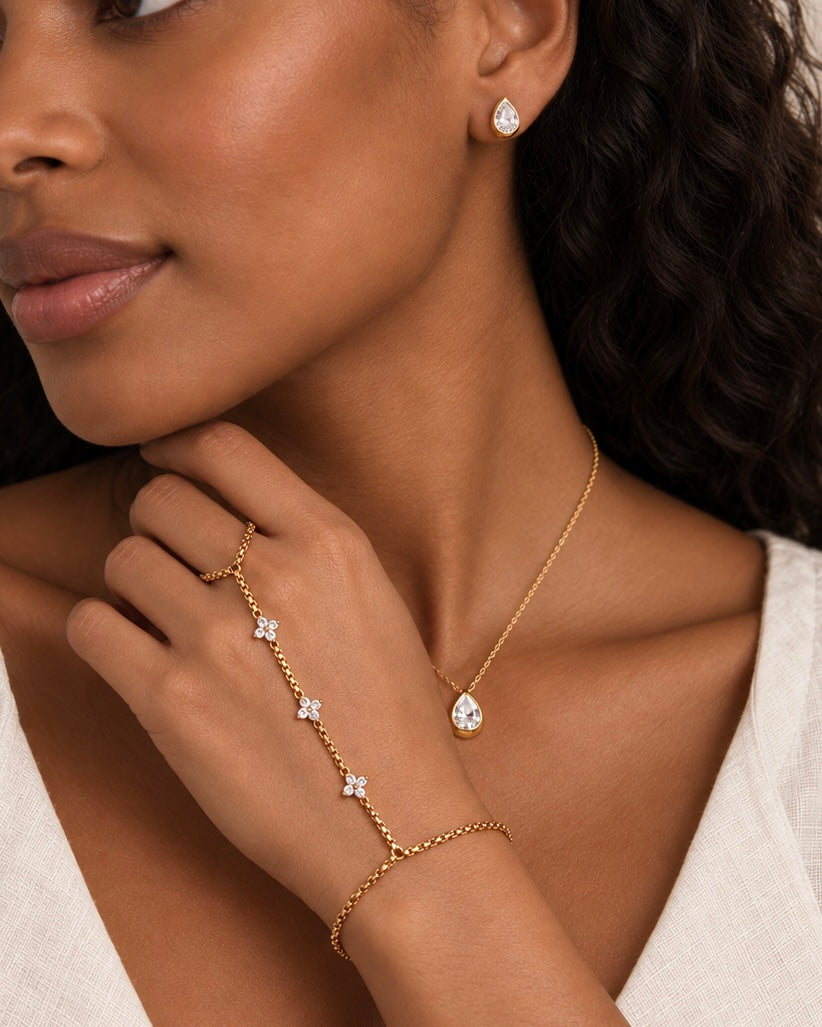 Hand chain worn with the matching pear drop necklace and stud earrings