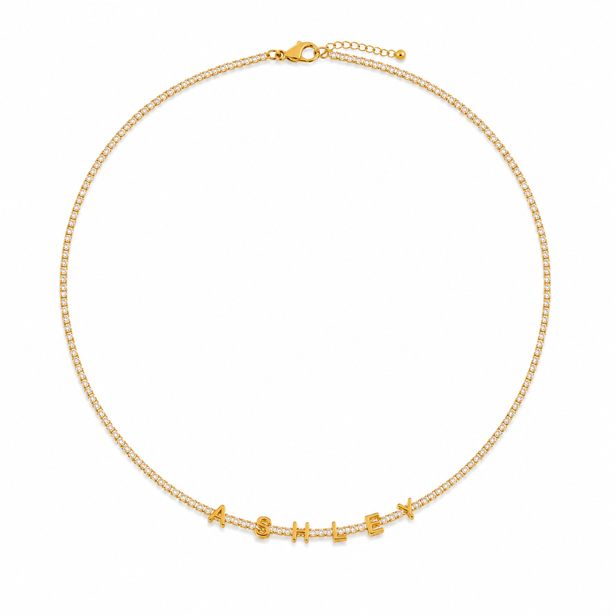 Full gold name tennis necklace laid in a circle, showing the lobster clasp and extender